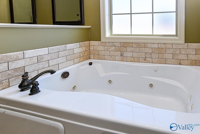 full bathroom featuring a whirlpool tub