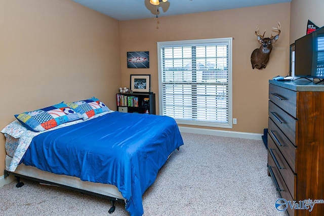 carpeted bedroom with baseboards