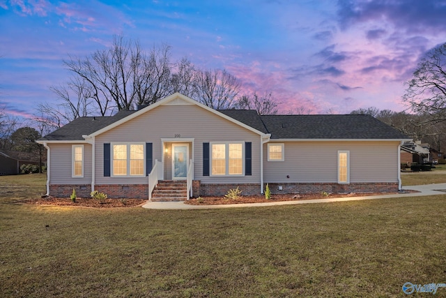 ranch-style house featuring a lawn