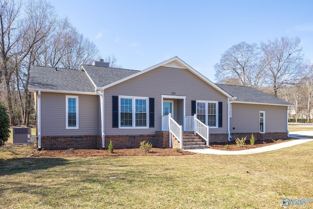 view of front of home featuring crawl space, a chimney, a front yard, and cooling unit