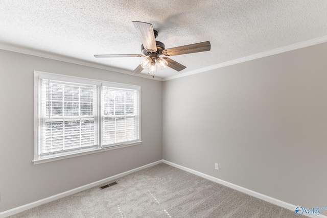 unfurnished room featuring light colored carpet, visible vents, baseboards, a ceiling fan, and ornamental molding