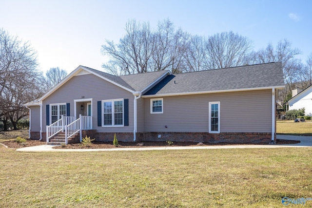 single story home featuring a front lawn and a shingled roof