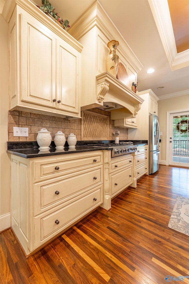 1805 Sibert Dr, Glencoe, AL 35905 - kitchen featuring stainless steel appliances, dark countertops, ornamental molding, dark wood-style flooring, and tasteful backsplash