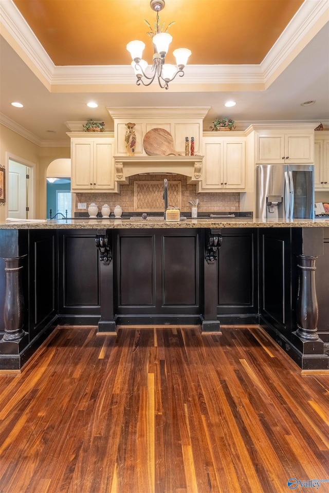 1805 Sibert Dr, Glencoe, AL 35905 - kitchen featuring stainless steel refrigerator with ice dispenser, cream cabinetry, dark wood-type flooring, light stone countertops, and a raised ceiling