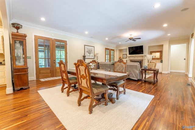 1805 Sibert Dr, Glencoe, AL 35905 - dining room featuring a ceiling fan, ornamental molding, french doors, dark wood finished floors, and a fireplace