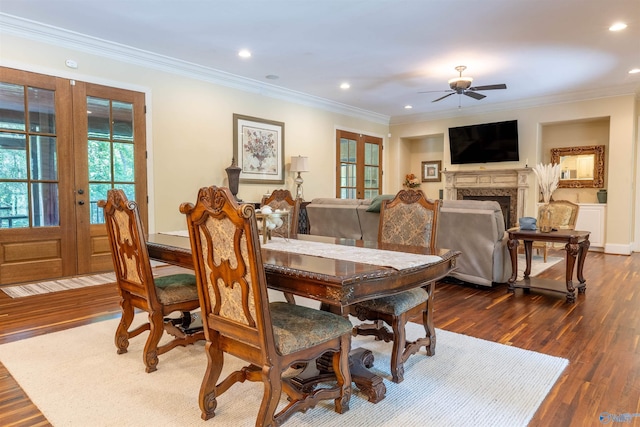 1805 Sibert Dr, Glencoe, AL 35905 - dining room with french doors, ceiling fan, dark wood finished floors, ornamental molding, and a fireplace