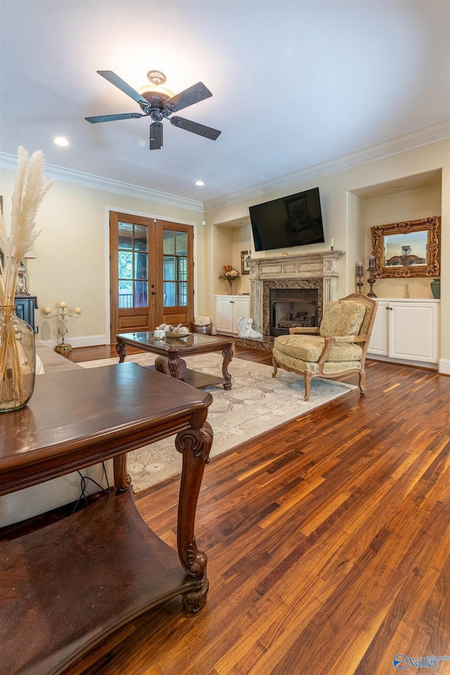 1805 Sibert Dr, Glencoe, AL 35905 - living area with ornamental molding, ceiling fan, a premium fireplace, french doors, and dark wood finished floors