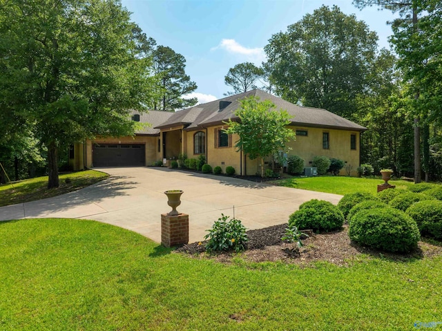 1805 Sibert Dr, Glencoe, AL 35905 - single story home with an attached garage, concrete driveway, a front lawn, and stucco siding