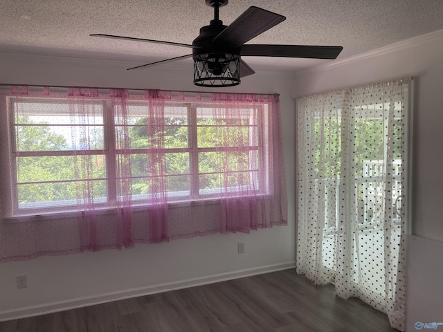 625 S Mountain Dr E, Trinity, AL 35673 - unfurnished dining area featuring a textured ceiling, a wealth of natural light, ceiling fan, and wood finished floors