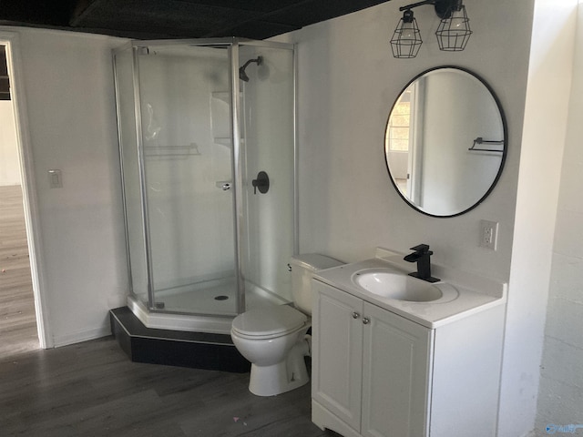 625 S Mountain Dr E, Trinity, AL 35673 - full bath with vanity, wood finished floors, toilet, baseboards, and a shower stall