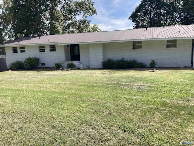 625 S Mountain Dr E, Trinity, AL 35673 - ranch-style house with brick siding, metal roof, and a front lawn