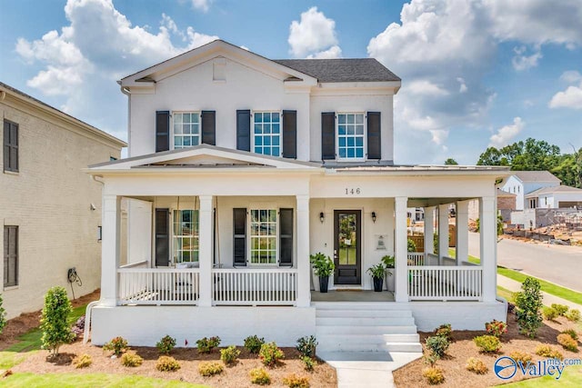 view of front of property featuring covered porch