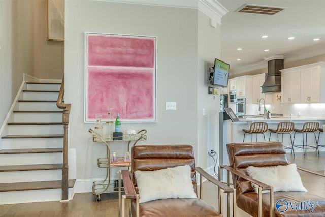 interior space featuring ornamental molding, sink, and dark hardwood / wood-style flooring