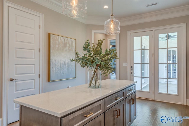 doorway to outside featuring hardwood / wood-style flooring and ornamental molding