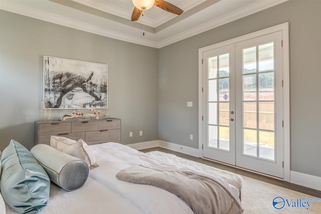 bedroom with hardwood / wood-style floors, ceiling fan, access to exterior, crown molding, and french doors