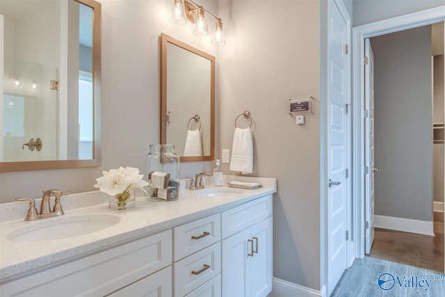 bathroom featuring vanity and hardwood / wood-style floors