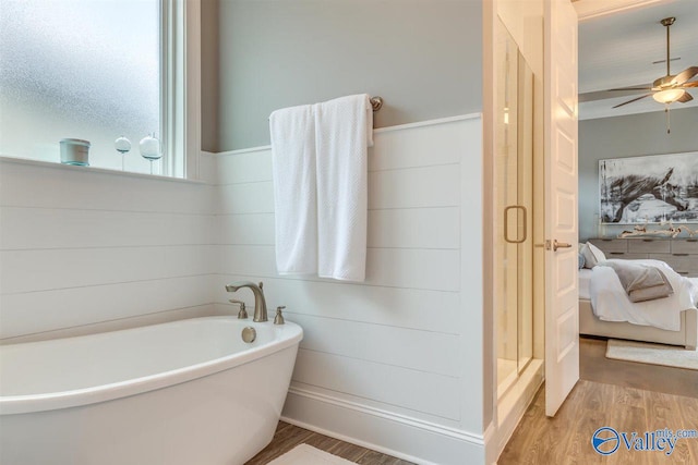 bathroom featuring hardwood / wood-style flooring, independent shower and bath, and ceiling fan