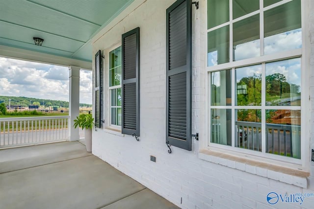 view of property exterior with covered porch