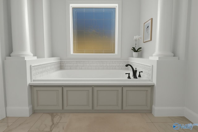 full bathroom featuring decorative columns and a garden tub