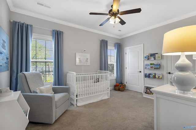 bedroom featuring visible vents, ornamental molding, multiple windows, and light carpet