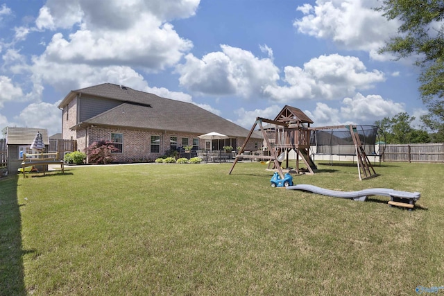 view of play area featuring fence and a yard