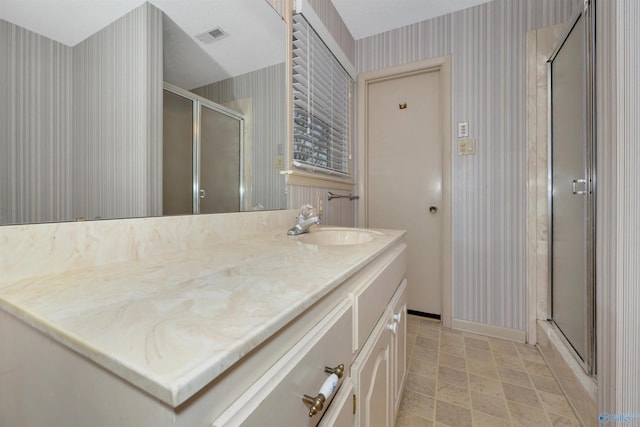 bathroom featuring vanity and walk in shower