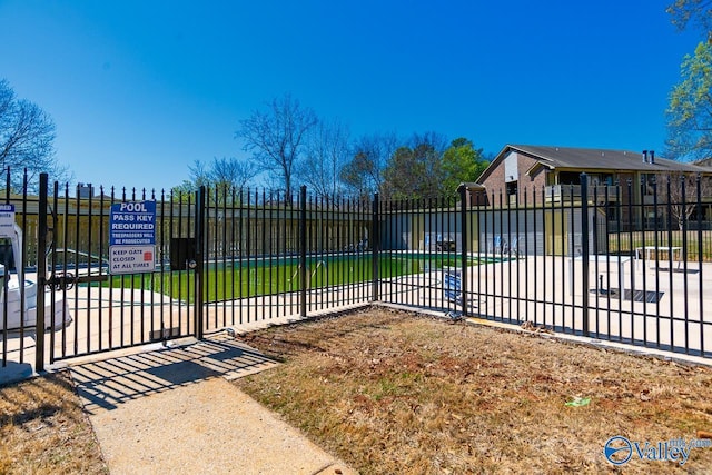 view of gate featuring fence