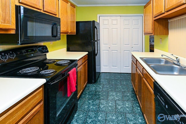 kitchen featuring light countertops, dark floors, a sink, black appliances, and brown cabinetry