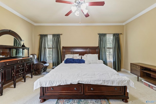 bedroom with ornamental molding, multiple windows, light colored carpet, and ceiling fan