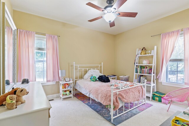 carpeted bedroom with ceiling fan