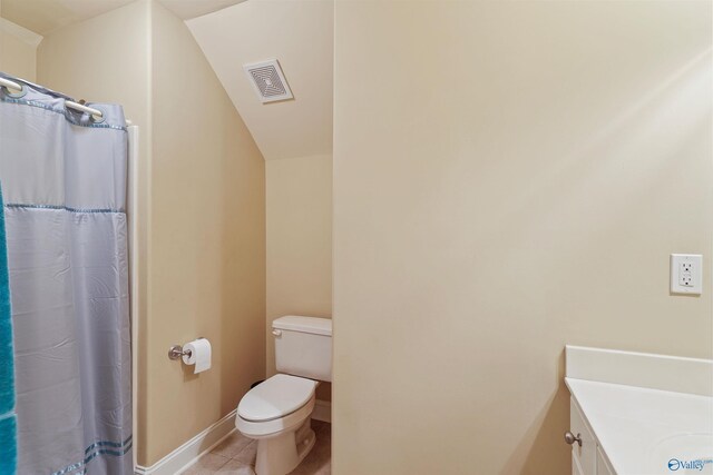 bathroom with vanity, toilet, a shower with curtain, tile patterned floors, and lofted ceiling