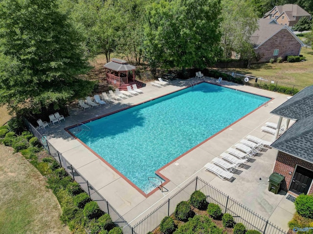 view of swimming pool with a patio and a gazebo