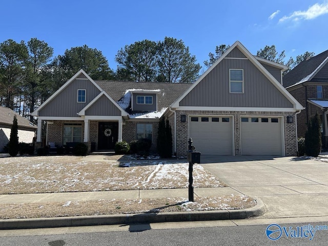 view of front of house featuring concrete driveway and brick siding