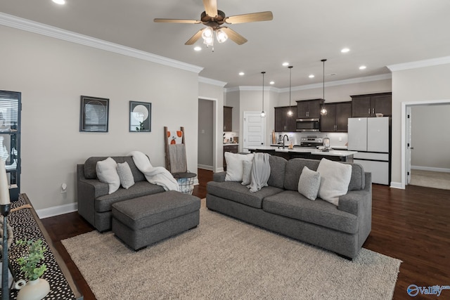 living room with ceiling fan, dark hardwood / wood-style flooring, and crown molding