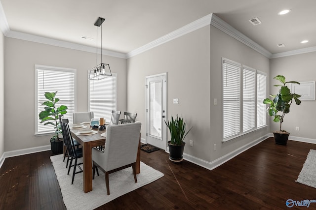 dining room with dark hardwood / wood-style floors and ornamental molding