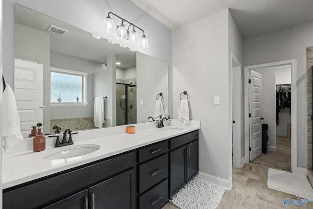 bathroom with vanity and an enclosed shower