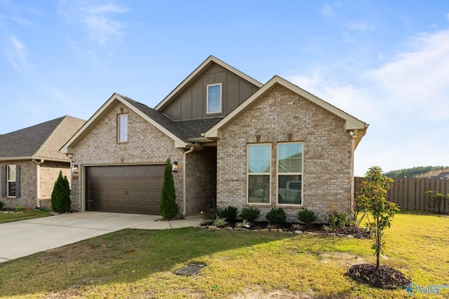 craftsman inspired home featuring a garage and a front lawn