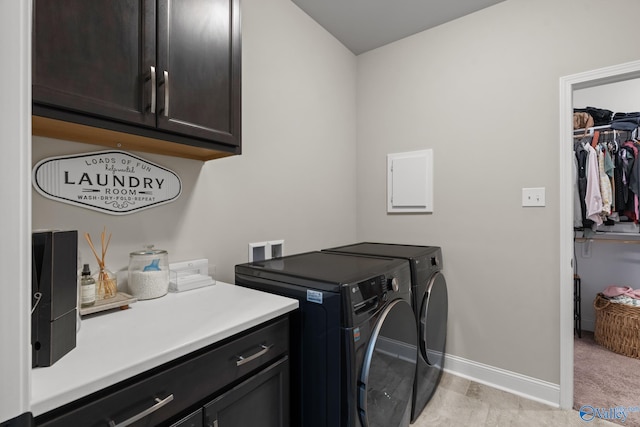 laundry room with cabinets and separate washer and dryer