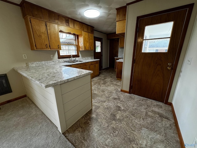 kitchen featuring kitchen peninsula and sink