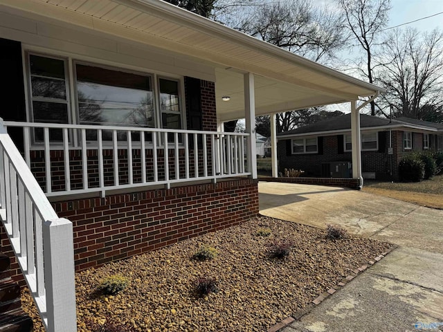 view of property exterior with a carport