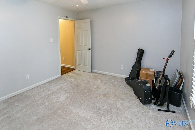 interior space with carpet flooring and baseboards