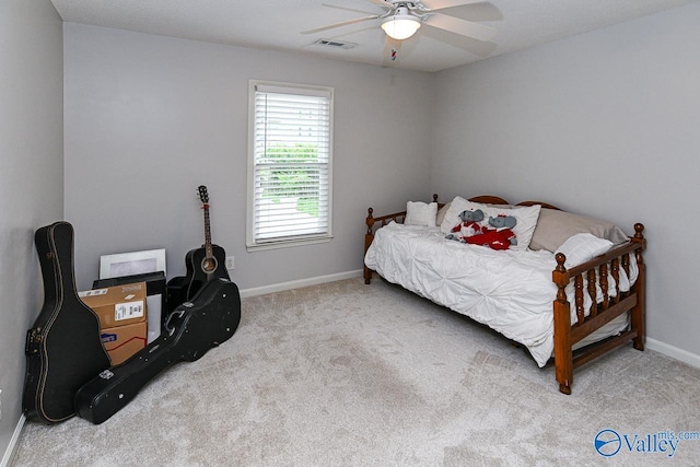 bedroom featuring carpet flooring, visible vents, ceiling fan, and baseboards