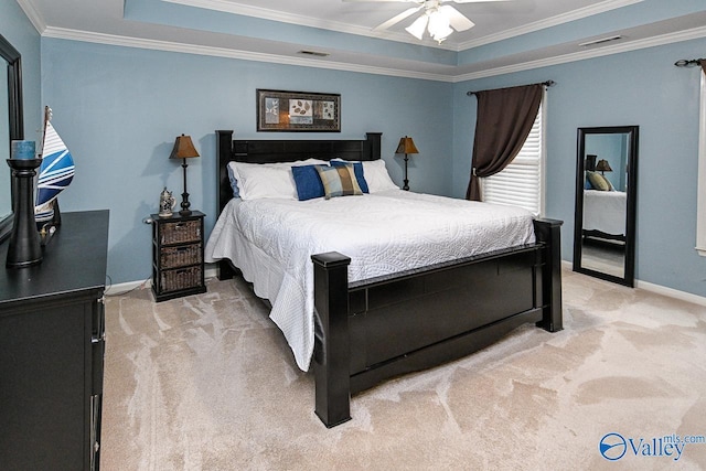 bedroom featuring light colored carpet, visible vents, ornamental molding, and baseboards