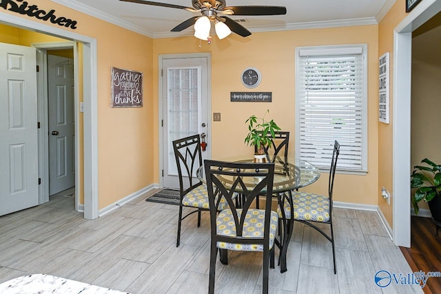 dining room featuring a ceiling fan, light wood-style floors, and baseboards