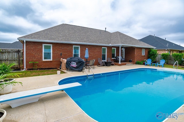 view of pool with a patio, fence, and a fenced in pool