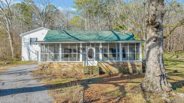 view of front of property with a sunroom