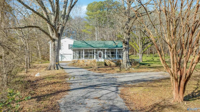 view of front of house featuring a sunroom