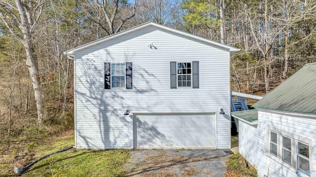 view of side of home with a garage