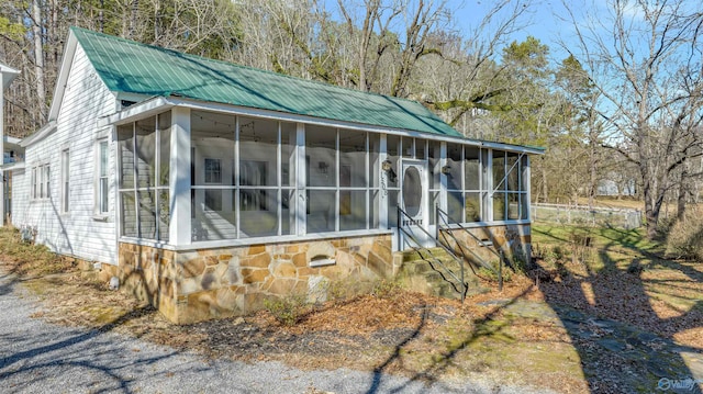 view of front of home with a sunroom