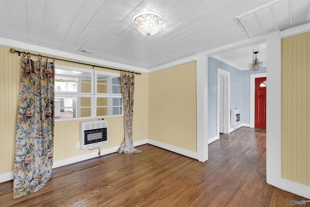 unfurnished room featuring hardwood / wood-style flooring, wood ceiling, and heating unit